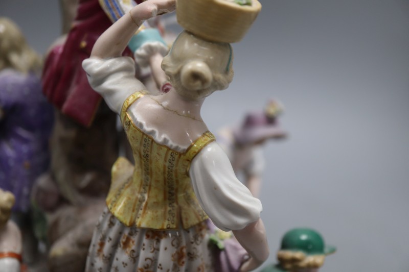 A 19th century Meissen gardening group, height 29cm, model D97